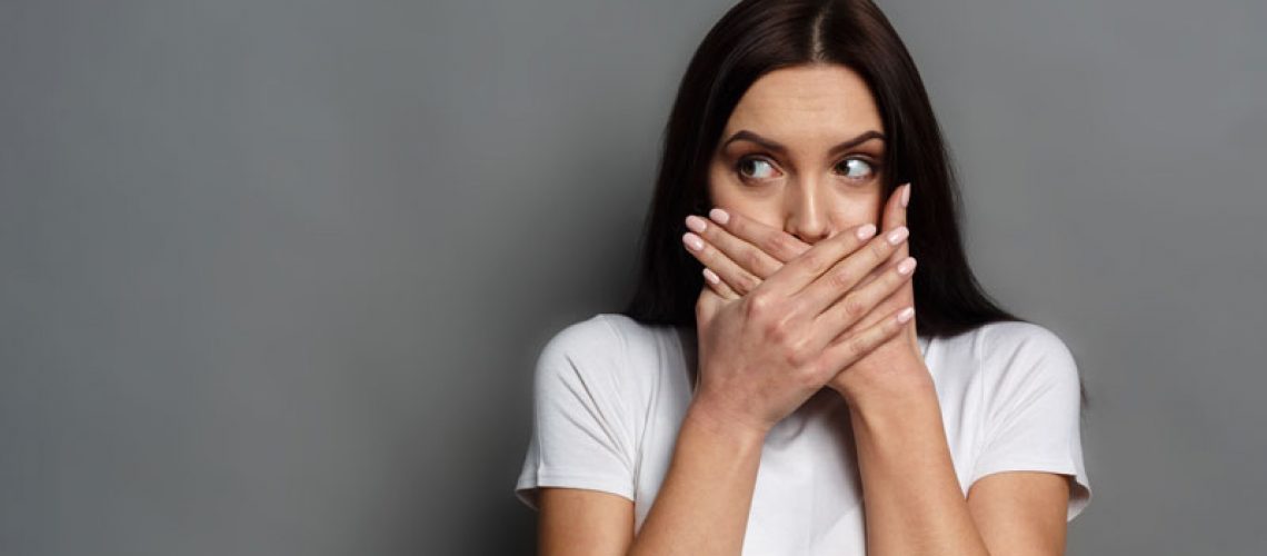 Dental Patient Hiding Her Mouth