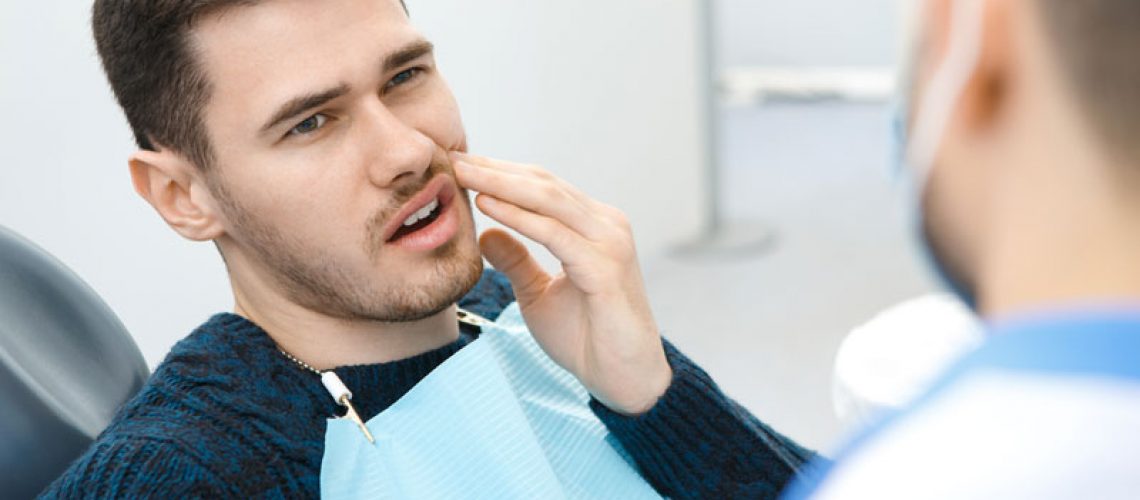 Dental Patient Suffering From Mouth Pain On A Dental Chair, In Blue Ridge, GA
